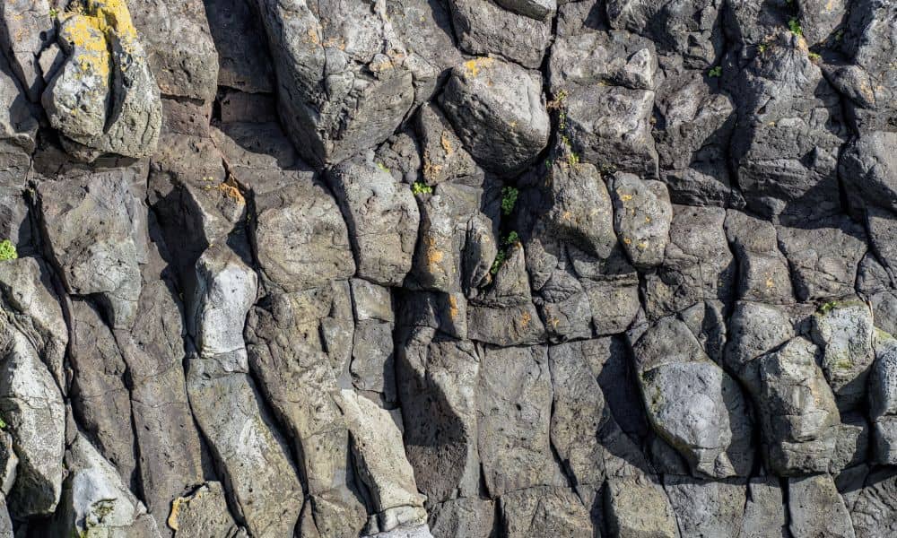 Lava rock wall at a property for property line survey planning